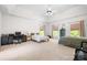 Spacious main bedroom features a high ceiling, fan, and two large windows at 16028 Hallaton Dr, Huntersville, NC 28078