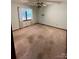 Standard Bedroom with old carpet and ceiling fan at 1623 Arbor Way, Albemarle, NC 28001