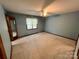 Cozy bedroom with carpet and ceiling fan at 1623 Arbor Way, Albemarle, NC 28001