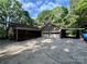 Spacious property featuring an attached two-car garage, a carport, and a covered porch at 1623 Arbor Way, Albemarle, NC 28001
