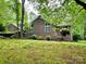 Charming brick home with well-maintained lawn, mature trees, and lush landscaping at 1623 Arbor Way, Albemarle, NC 28001