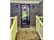 Welcoming front porch with brick steps, white railings, and a glass front door at 1623 Arbor Way, Albemarle, NC 28001