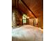Large living room with a stone fireplace, wood-paneled walls, and expansive windows allowing ample light at 1623 Arbor Way, Albemarle, NC 28001