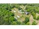 Real estate featuring residential buildings, greenhouse structures, and farming lands, all enclosed by dense trees at 1687 Windy Hill Ln, Great Falls, SC 29055