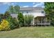 Expansive backyard with a covered patio, perfect for outdoor entertaining and relaxation at 1687 Windy Hill Ln, Great Falls, SC 29055
