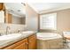Large bathroom with double sinks, and large soaking tub at 1687 Windy Hill Ln, Great Falls, SC 29055