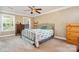 Bedroom featuring a queen size bed, side tables, ceiling fan and two large windows at 1687 Windy Hill Ln, Great Falls, SC 29055