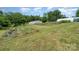 Expansive field with gardening structures, creating a picturesque setting for outdoor activities and landscaping at 1687 Windy Hill Ln, Great Falls, SC 29055