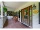 Cozy front porch with wooden chairs and a charming front door, enhancing the home's curb appeal at 1687 Windy Hill Ln, Great Falls, SC 29055