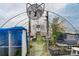 Well-ventilated greenhouse interior with benches, tables, fan, and plant growing supplies at 1687 Windy Hill Ln, Great Falls, SC 29055