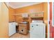 Functional laundry room with ample storage, a utility sink, washer and dryer at 1687 Windy Hill Ln, Great Falls, SC 29055
