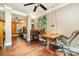 Well-lit office space featuring hardwood floors and natural light, perfect for a home office setup at 1687 Windy Hill Ln, Great Falls, SC 29055