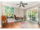 Bright office area with sliding doors to the outside and modern light fixture at 1687 Windy Hill Ln, Great Falls, SC 29055