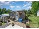 Charming outbuilding with a small deck, offering a unique space for various activities at 1687 Windy Hill Ln, Great Falls, SC 29055