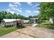 Diverse property featuring a small building, greenhouse, and plenty of greenery at 1687 Windy Hill Ln, Great Falls, SC 29055