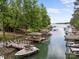 Scenic waterfront home featuring private boat docks and a covered outdoor living space for relaxing lake views at 19614 Meta Rd, Cornelius, NC 28031