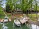 Stunning lakefront estate featuring a multi-tiered backyard with private boat dock and ample space for entertaining at 19614 Meta Rd, Cornelius, NC 28031