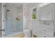 Bright bathroom with glass shower, tiled floor, vanity with ample counter space and storage at 19614 Meta Rd, Cornelius, NC 28031