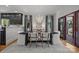 Elegant dining room with a dark wood table, chandelier, and modern decor, perfect for Gathering gatherings at 19614 Meta Rd, Cornelius, NC 28031