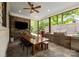 Well-equipped outdoor kitchen with a large grill, stainless steel appliances, and dining table for al fresco meals at 19614 Meta Rd, Cornelius, NC 28031