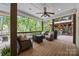 Comfortable outdoor deck featuring cozy seating and backyard views for enjoying relaxing moments at 19614 Meta Rd, Cornelius, NC 28031