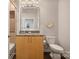 Bright bathroom featuring wood vanity, granite countertop, neutral colors, and tiled shower at 210 N Church St # 2613, Charlotte, NC 28202