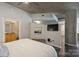 Spacious bedroom boasts a view of the bathroom and concrete pillar adding architectural detail at 210 N Church St # 2613, Charlotte, NC 28202