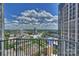 Enjoy skyline views from this high-rise balcony with blue skies and towering clouds at 210 N Church St # 2613, Charlotte, NC 28202