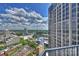 Enjoy city views from this high-rise balcony with blue skies and clouds at 210 N Church St # 2613, Charlotte, NC 28202