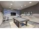Well-lit game room with a billiards table, television, and comfortable seating for entertainment at 210 N Church St # 2613, Charlotte, NC 28202