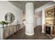 Stylish hallway features modern decor, a wine rack with beverage cooler, and concrete pillar at 210 N Church St # 2613, Charlotte, NC 28202