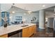 Open floorplan with kitchen island, quartz countertops and stainless dishwasher at 210 N Church St # 2613, Charlotte, NC 28202