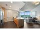 Contemporary kitchen island with views of the living room and city skyline at 210 N Church St # 2613, Charlotte, NC 28202