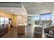 Open kitchen with stainless appliances, island with seating, and living area views at 210 N Church St # 2613, Charlotte, NC 28202