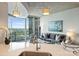 Bright living room with skyline views visible from the kitchen island at 210 N Church St # 2613, Charlotte, NC 28202