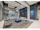 Modern lobby with a waterfall wall, gray couch, and stylish seating at 210 N Church St # 2613, Charlotte, NC 28202