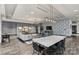 Modern lounge area with decorative wallpaper, long table, and stylish seating at 210 N Church St # 2613, Charlotte, NC 28202