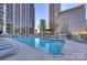 Scenic rooftop pool with lounge chairs and views of surrounding city skyline at 210 N Church St # 2613, Charlotte, NC 28202