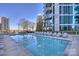 Scenic rooftop pool with lounge chairs and views of surrounding city skyline at 210 N Church St # 2613, Charlotte, NC 28202