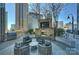 Relaxing rooftop deck area with outdoor seating, a fireplace, and a barbecue grill at 210 N Church St # 2613, Charlotte, NC 28202