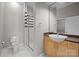 Modern bathroom with a glass-enclosed shower, contemporary fixtures, and well-lit vanity area at 2125 Southend Dr # 448, Charlotte, NC 28203
