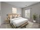 Stylishly furnished bedroom with a large bed, contemporary decor, and ample natural light at 2125 Southend Dr # 448, Charlotte, NC 28203