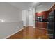 Open living area with hardwood floors adjoining kitchen area, providing a welcoming space at 2125 Southend Dr # 448, Charlotte, NC 28203