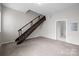 Bright living room features a staircase, a toilet room, and provides versatile area for a home office at 2125 Southend Dr # 448, Charlotte, NC 28203