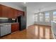 Open living area with hardwood floors adjoining kitchen area, providing a welcoming space at 2125 Southend Dr # 448, Charlotte, NC 28203