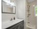 Updated bathroom features a shower-tub combination and a modern vanity with mirror at 2313 Eleanor Dr, Shelby, NC 28150