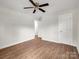 Spacious bedroom features wood-look flooring, a ceiling fan, and closets at 2313 Eleanor Dr, Shelby, NC 28150