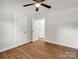 Bedroom with wood-look flooring, a ceiling fan, and a closet at 2313 Eleanor Dr, Shelby, NC 28150