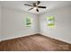Spacious bedroom features wood-look flooring and plenty of natural light from two windows at 2313 Eleanor Dr, Shelby, NC 28150