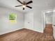 This bedroom features wood-look flooring, a ceiling fan, and closet at 2313 Eleanor Dr, Shelby, NC 28150